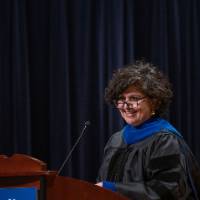 Woman speaks at podium